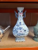 A repro Chinese blue and white vase on square foot