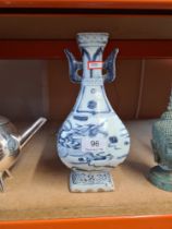 A repro Chinese blue and white vase on square foot