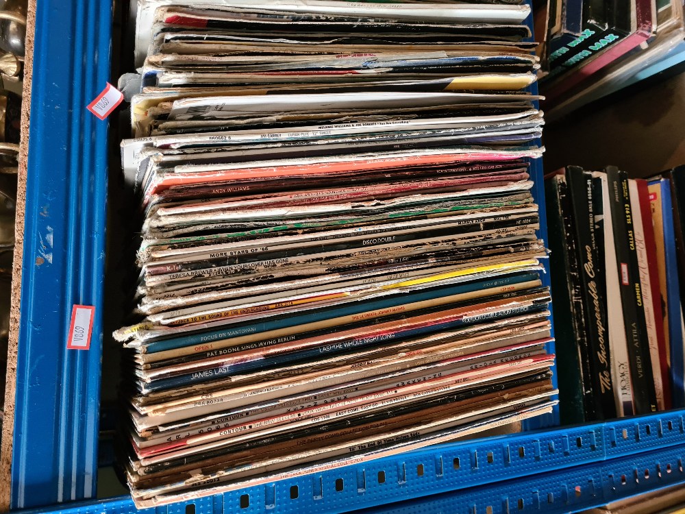 A shelf of vinyl LP's. tacky covers