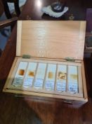 A box containing microscopic slides, a box of scales and sundry