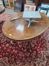 A Victorian burr walnut oval loo table on carved Quadra pod base, 126cm