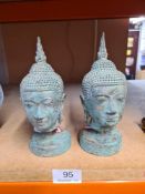 A pair of small Thai style Buddha heads, 17cm