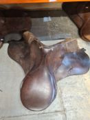 Three Leather horse saddles