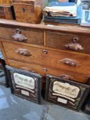 Two over three drawer chest of drawers with carved handles