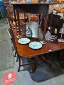 A reproduction mahogany twin pedestal dining table having 2 additional leaves and 8 Hepplewhite styl