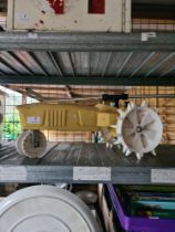 A cast iron garden sprayer in form of tractor