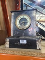 A Victorian black marble mantle clock