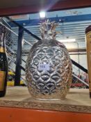 A modern plated ice bucket in form of a pineapple