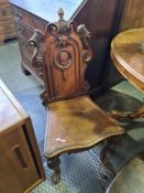 Ornate carved chair with shield design to middle back