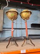 A pair of reproduction miniature globes on tripod supports