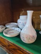 A quantity of Wedgwood angela design china items over 3 shelves