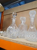 A quantity of decanters and similar