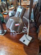 A vintage Anglepoise Lighting Limited desk lamp and a vintage glass lamp