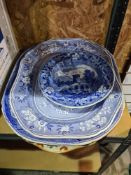 Two large blue and white platters, one other platter and two soup plates