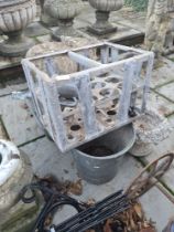 A selection of metalware including hanging baskets, white stone urn, galvanised bucket, seed drill,