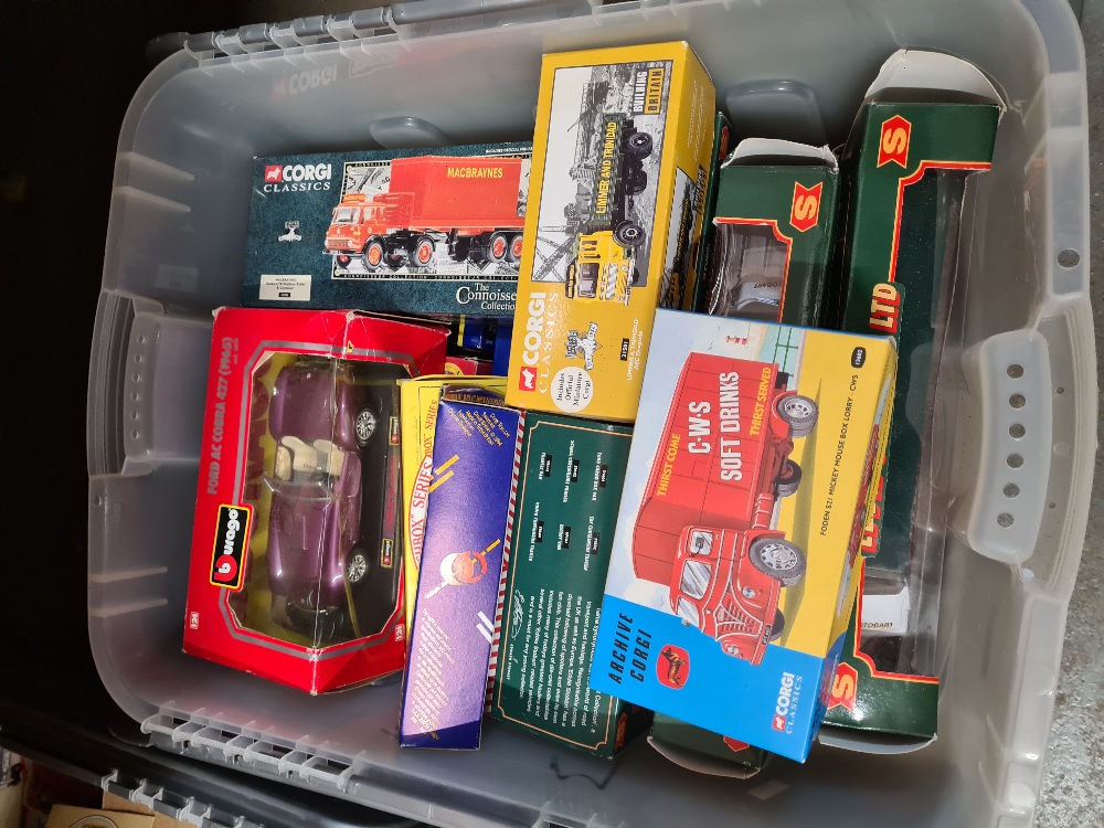 Two boxes of modern die cast vehicles, including Corgi examples
