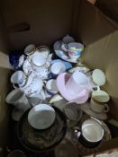 A box of decorative cups and saucers