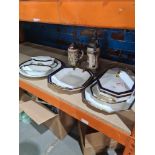 A small quantity of Austrian Porcelain dinnerware having blue and gilt border and 2 Stein tankards