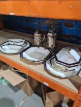 A small quantity of Austrian Porcelain dinnerware having blue and gilt border and 2 Stein tankards