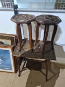 Two small octagonal carved tables and one other 2 tier example