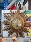 A small gilt Sunburst clock