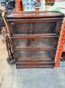 A Globe Wernicke 3 section bookcase and one other oak 3 section book case having lower drawer