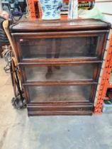 A Globe Wernicke 3 section bookcase and one other oak 3 section book case having lower drawer