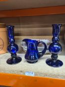 A pair of Bristol Blue candlesticks by Thomas Webb, a similar jug and plates