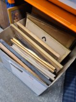 A box of pictures, mainly prints