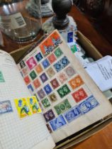 A selection of various stamps and albums from around the World including cigarette cards, etc