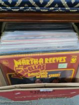 A box of vinyl LPs of various genres from Motown to Folk