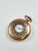 Antique gold plated half hunter pocket watch with white enamel dial with Roman numerals and subsidia