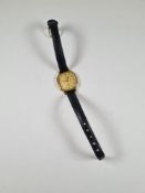 Omega; a ladies Omega De Ville wristwatch with leather strap. Quartz movement. Missing crown and not