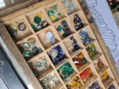 Tray of various coloured stones, mostly paste, amethyst, pearl, etc