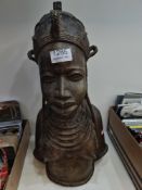 An African bust of lady with hat and necklaces, possibly bronze, and from Senegal, 43cm