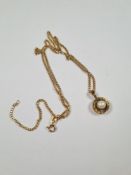 9ct yellow gold curblink bracelet hung with 9ct gold pendant with central pearl, marked 375, approx