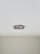 Contemporary 9ct white gold split band ring band ring of asymetric design set diamonds, marked 375,