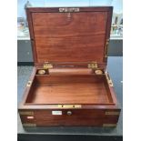 A brass 19th Century mahogany brass bound travelling box, probably for Naval use having removable tr