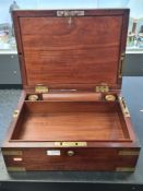 A brass 19th Century mahogany brass bound travelling box, probably for Naval use having removable tr