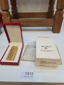 Cartier; an early 1980s cigarette lighter having gilt finish in fitted case, with certificate and or