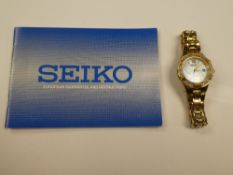 Seiko; ladies Seiko dress watch, solar with Mother of Pearl dial, baton and Roman numerals, date ape