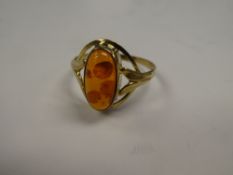 8ct yellow gold dress ring with decorative panel with oval amber style stone, marked 333, size X, ap