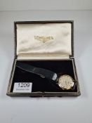 Longines; a 1960s 9ct gold cased Longines wristwatch, with champagne dial and baton markers, subsidi