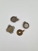 Three silver mounted coins including one 1846 shilling and another Chinese? coin