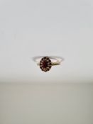 9ct yellow gold garnet set cluster ring marked 375, maker LOP Ltd., size O, approx 2g