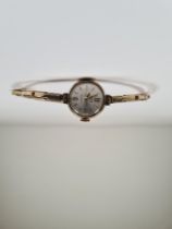 Vintage 9ct yellow gold ladies 'Uno' watch on 9ct yellow gold expanding strap, Champagne dial and ba