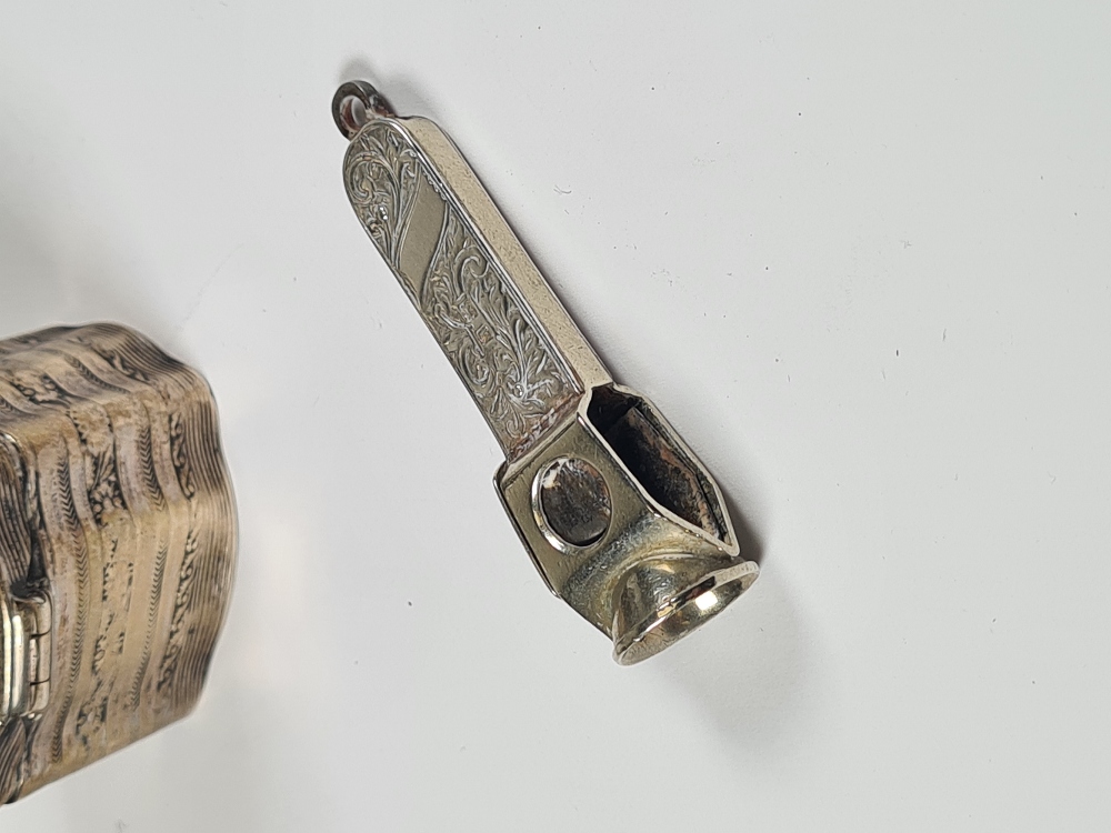 A decorative silver cigarette cutter having a decorative body covered in foliate scrolls, by Henry C - Image 3 of 12