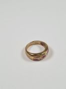9ct yellow gold band ring of crossover design inset square cut rubies and round cut diamonds, size M