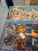 Tray of vintage costume jewellery to include two large silver brooches in the form of a dragon fly a