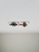 Two 9ct yellow gold dress rings, a sapphire and clear stoned cluster ring and a garnet and cubic zir